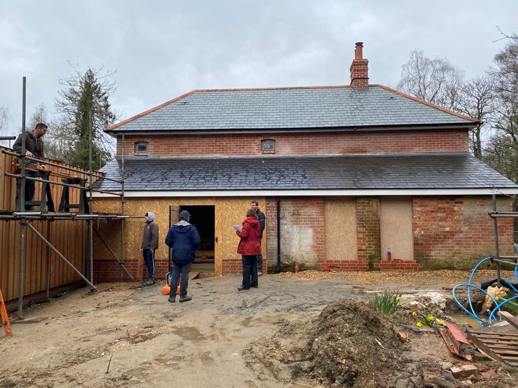 Front of cottage with the wooden extension left